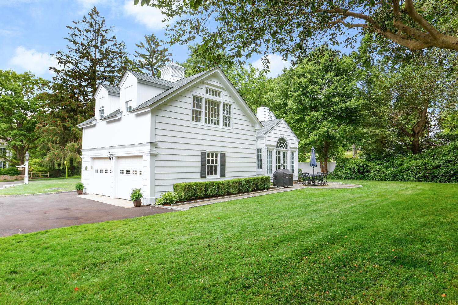 110 Gower Road New Canaan, CT 06840 - Photo 25 of 39 a view of a house with a yard
