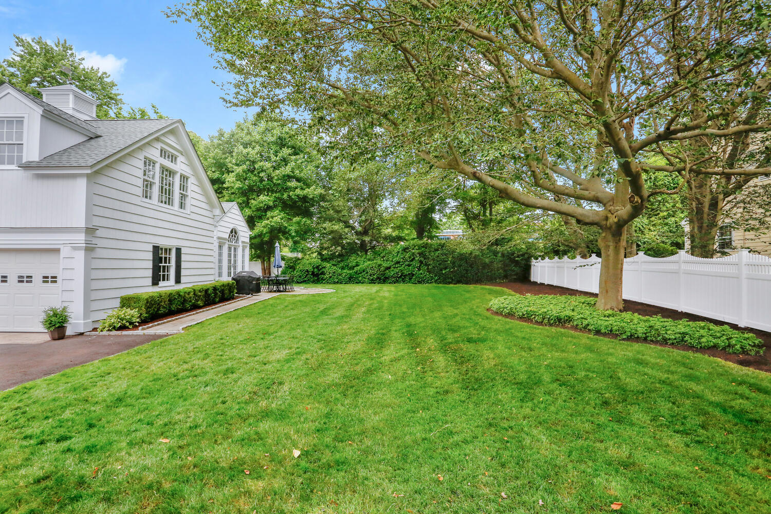 110 Gower Road New Canaan, CT 06840 - Photo 27 of 39 a view of a house with a yard