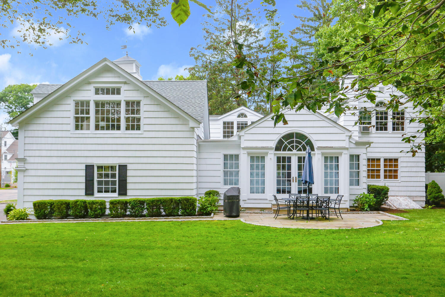 110 Gower Road New Canaan, CT 06840 - Photo 29 of 39 a front view of a house with yard and green space