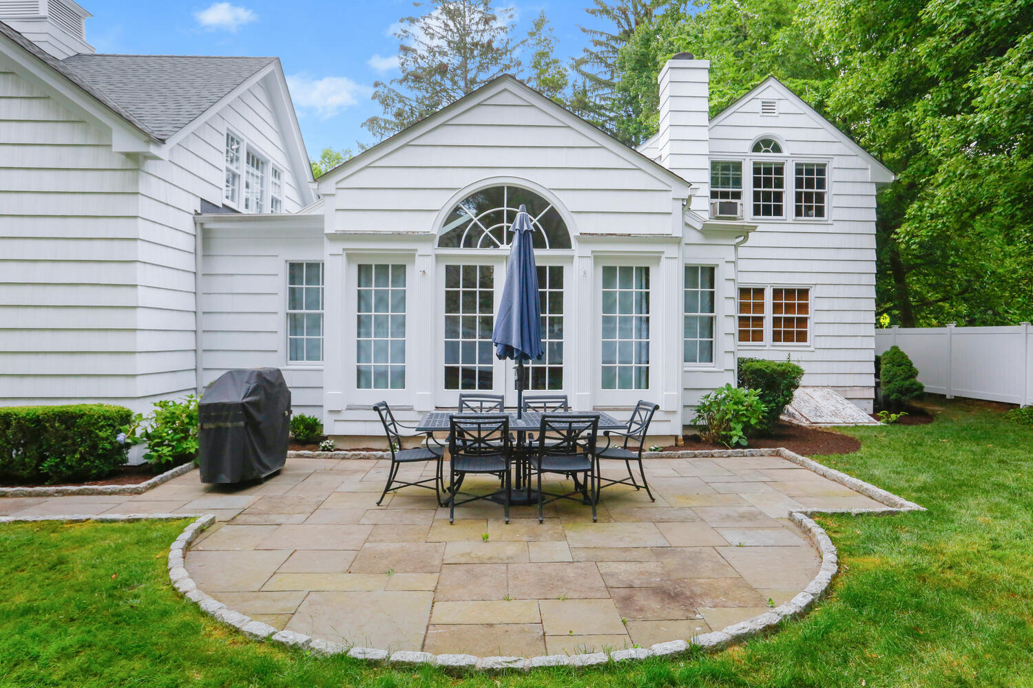 110 Gower Road New Canaan, CT 06840 - Photo 30 of 39 a view of a house with backyard and sitting area