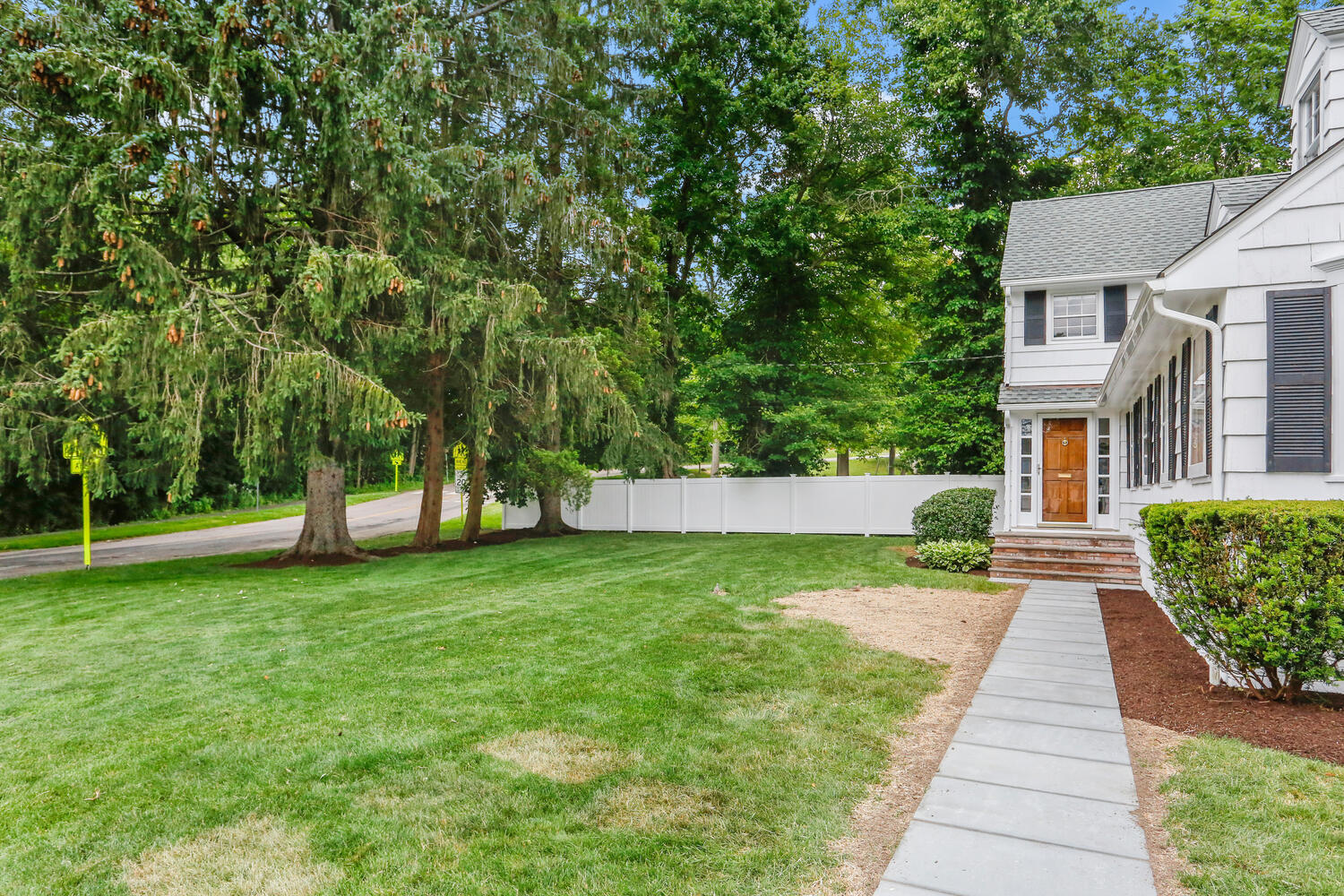 110 Gower Road New Canaan, CT 06840 - Photo 32 of 39 a view of a house with a yard