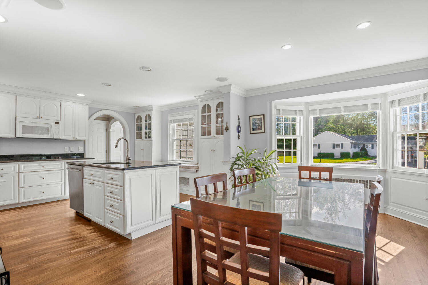 110 Gower Road New Canaan, CT 06840 - Photo 9 of 39 a kitchen with stainless steel appliances granite countertop a stove and cabinets