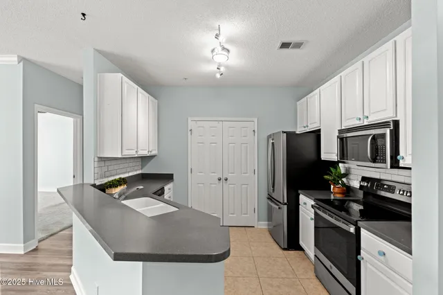 $409,000 | 1135 Park Road Southwest, Unit 1203, Sunset Beach, NC 28468