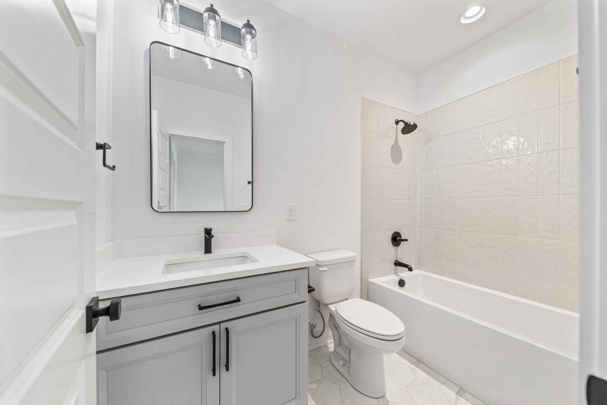 414 Conant Street Columbia, TN 38401 - Photo 36 of 48 a bathroom with a toilet sink vanity tub and mirror