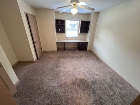 203 Kelly Road, Unit 114 Clemson, SC 29631 - Photo 24 of 37 A built-in desk alcove creates a perfect workspace in this carpeted room.