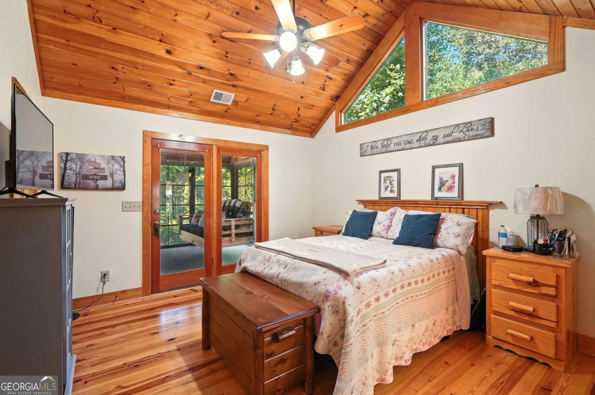 772 Rickman Airfield Road Clayton, GA 30525 - Photo 32 of 64 a bed room with a bed and a window