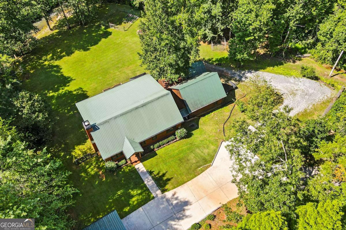 772 Rickman Airfield Road Clayton, GA 30525 - Photo 7 of 64 an aerial view of a house with a yard and swimming pool