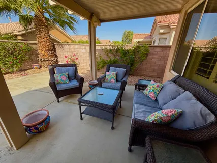 a outdoor living space with furniture and a potted plant