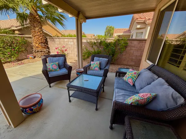 a outdoor living space with furniture and a potted plant