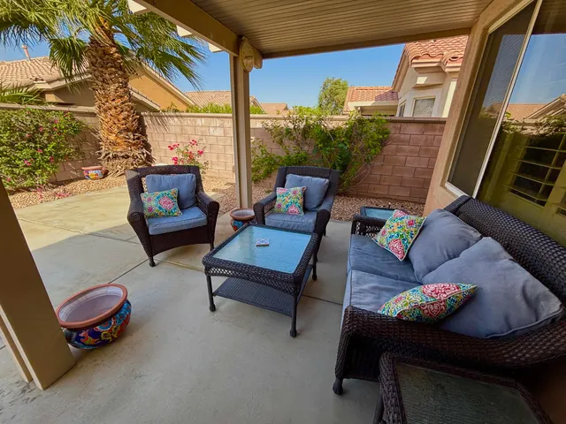 a outdoor living space with furniture and a potted plant