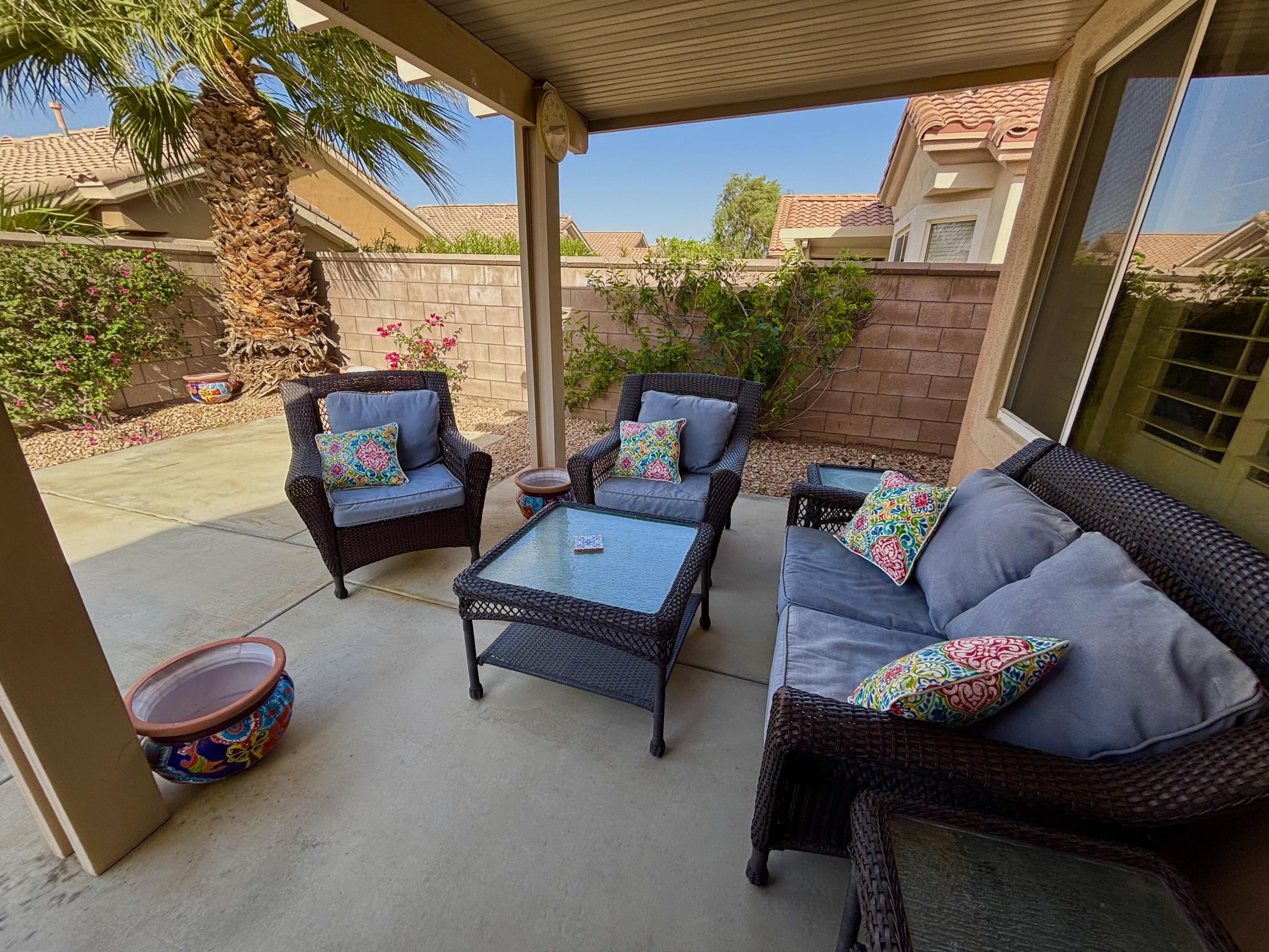 78724 Palm Tree Avenue Palm Desert, CA 92211 - Photo 13 of 14 a outdoor living space with furniture and a potted plant