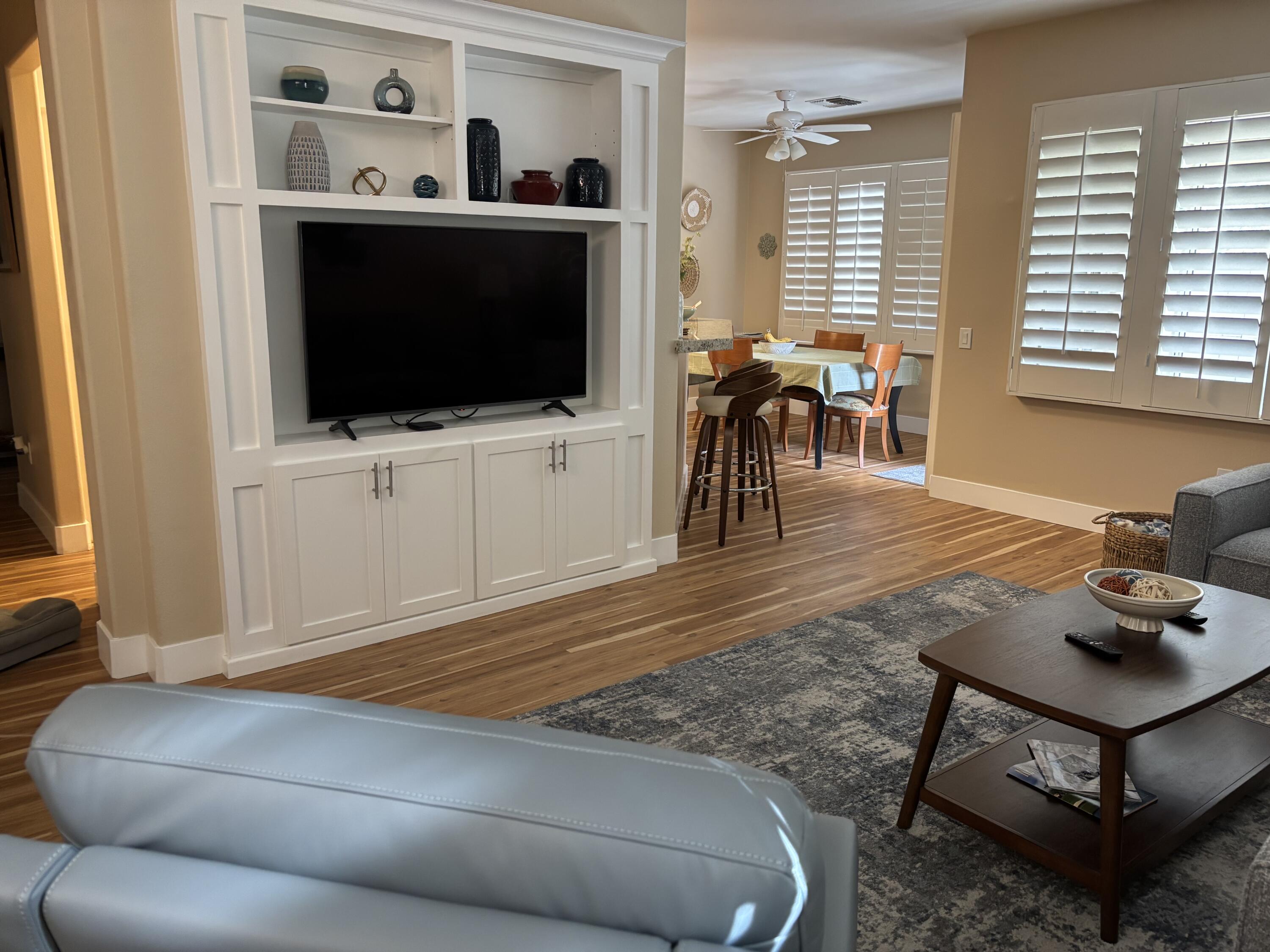 78724 Palm Tree Avenue Palm Desert, CA 92211 - Photo 3 of 14 a living room with furniture and a flat screen tv