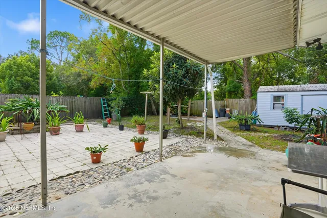 a view of a backyard with sitting area