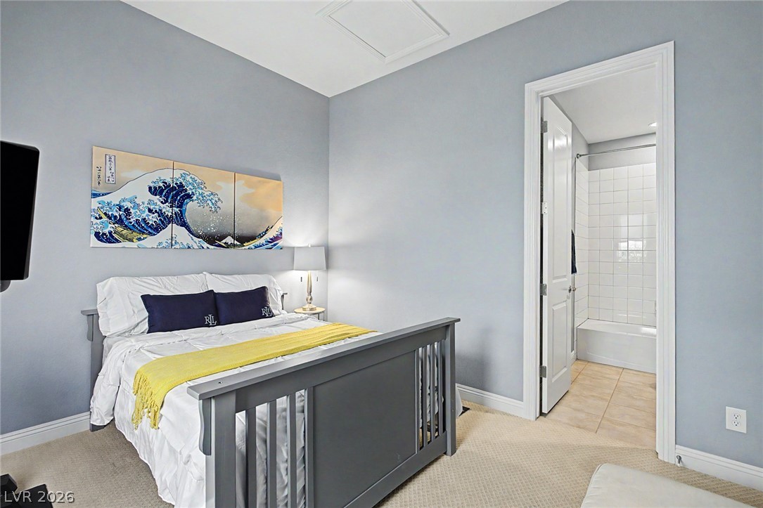 6014 Willow Ridge Court Las Vegas, NV 89135 - Photo 56 of 99 This spacious bedroom offers a tranquil retreat with convenient access to a private bath.