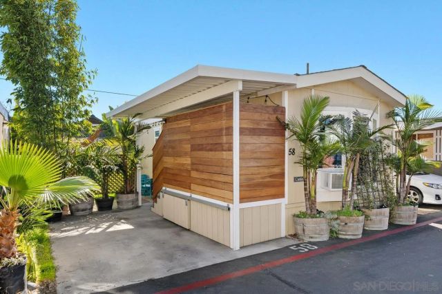 a view of a house with a tree