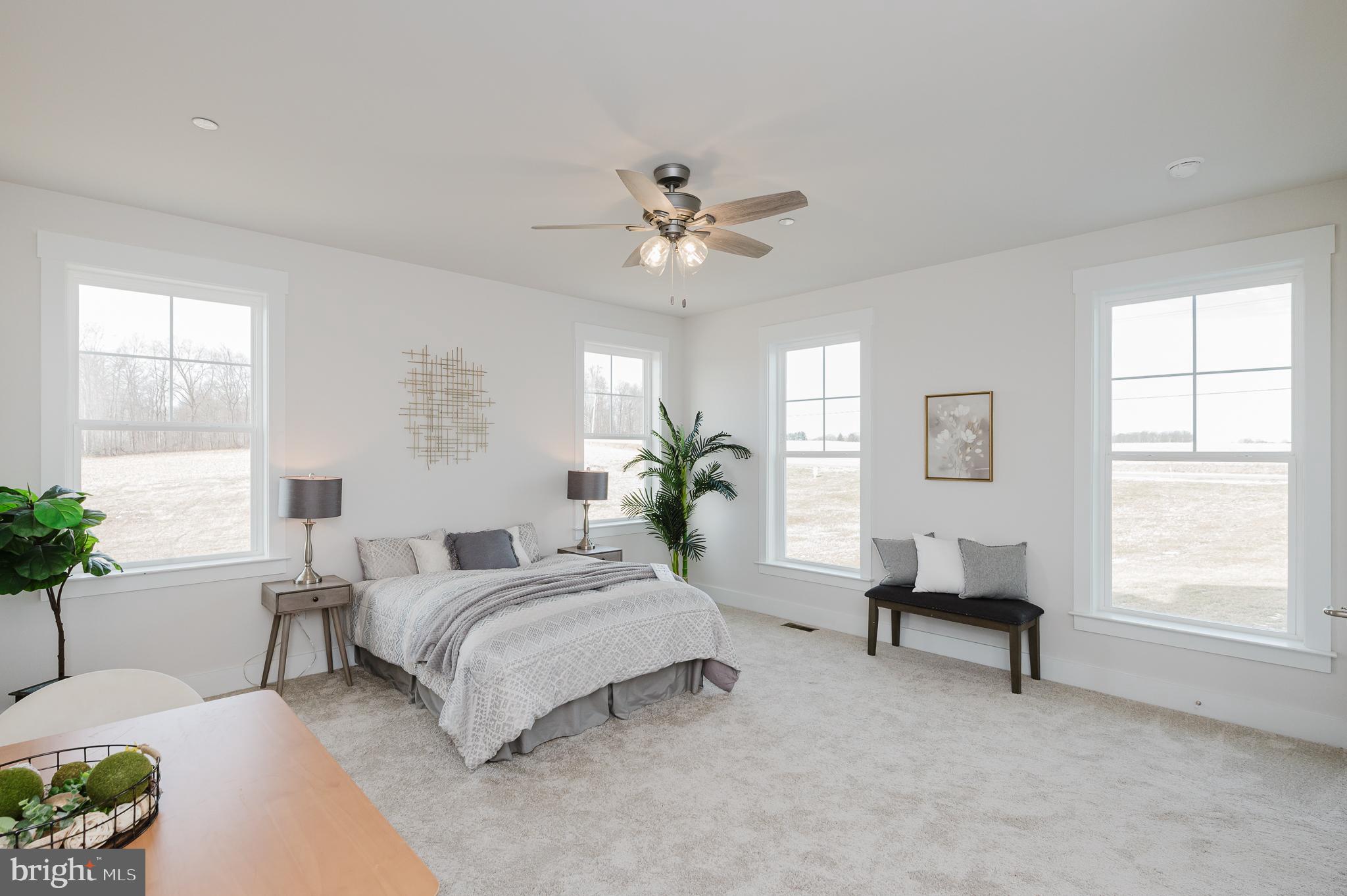 1605 A Oakland Road Freeland, MD 21053 - Photo 22 of 32 a spacious bedroom with a bed and a chandelier