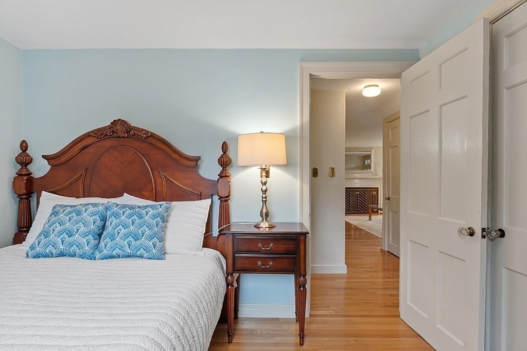 5 Gleason Road Lexington, MA 02420 - Photo 17 of 32 a bedroom with a bed and wooden floor