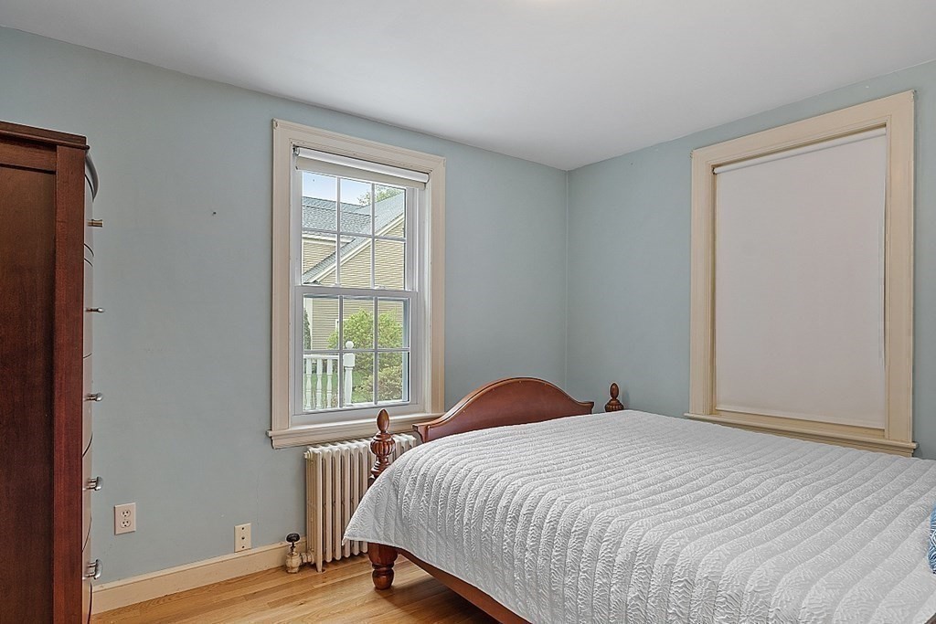 5 Gleason Road Lexington, MA 02420 - Photo 18 of 32 a bedroom with a bed and a window