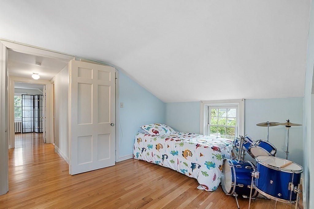 5 Gleason Road Lexington, MA 02420 - Photo 20 of 32 a bedroom with a bed and wooden floor