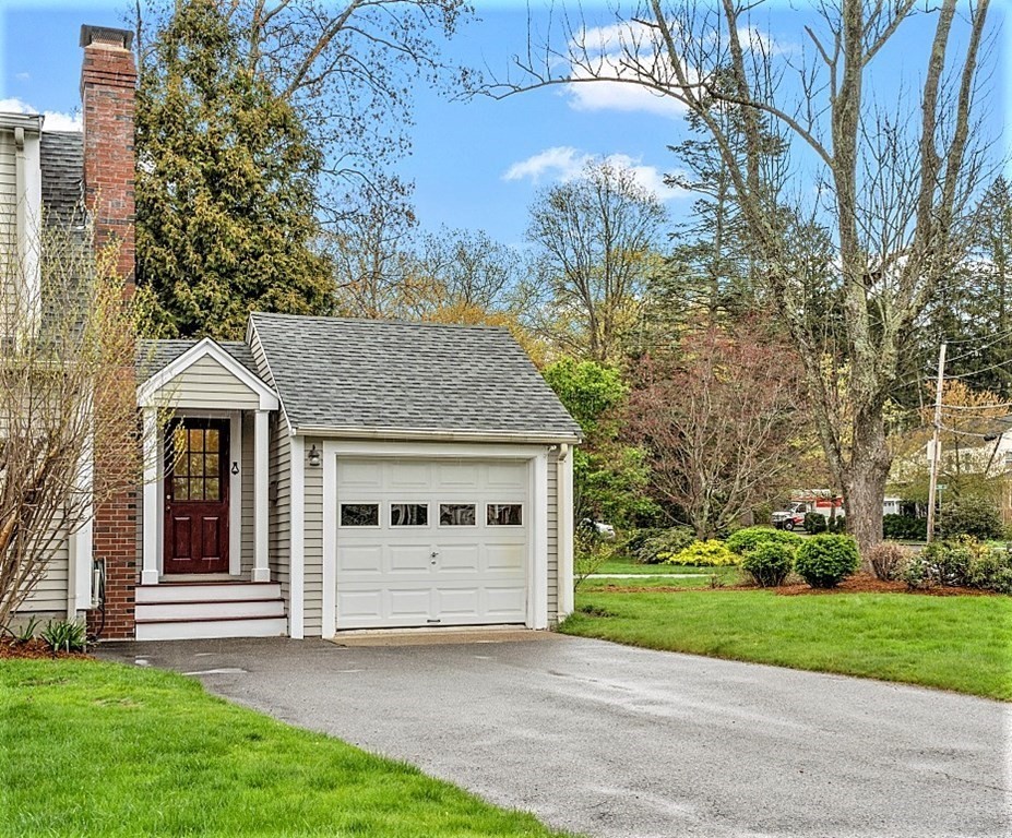 5 Gleason Road Lexington, MA 02420 - Photo 24 of 32 a front view of a house with a yard and garage