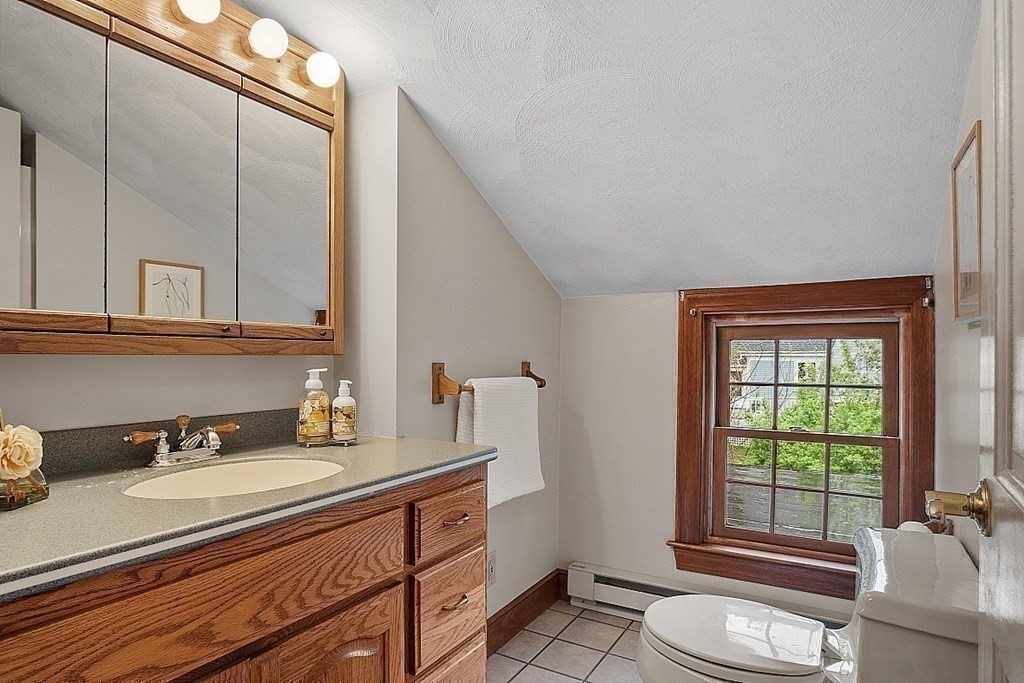 5 Gleason Road Lexington, MA 02420 - Photo 26 of 32 a bathroom with a sink double vanity and a shower