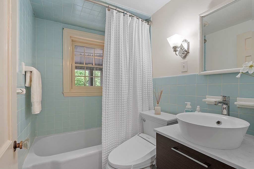 5 Gleason Road Lexington, MA 02420 - Photo 28 of 32 a bathroom with a sink toilet and shower