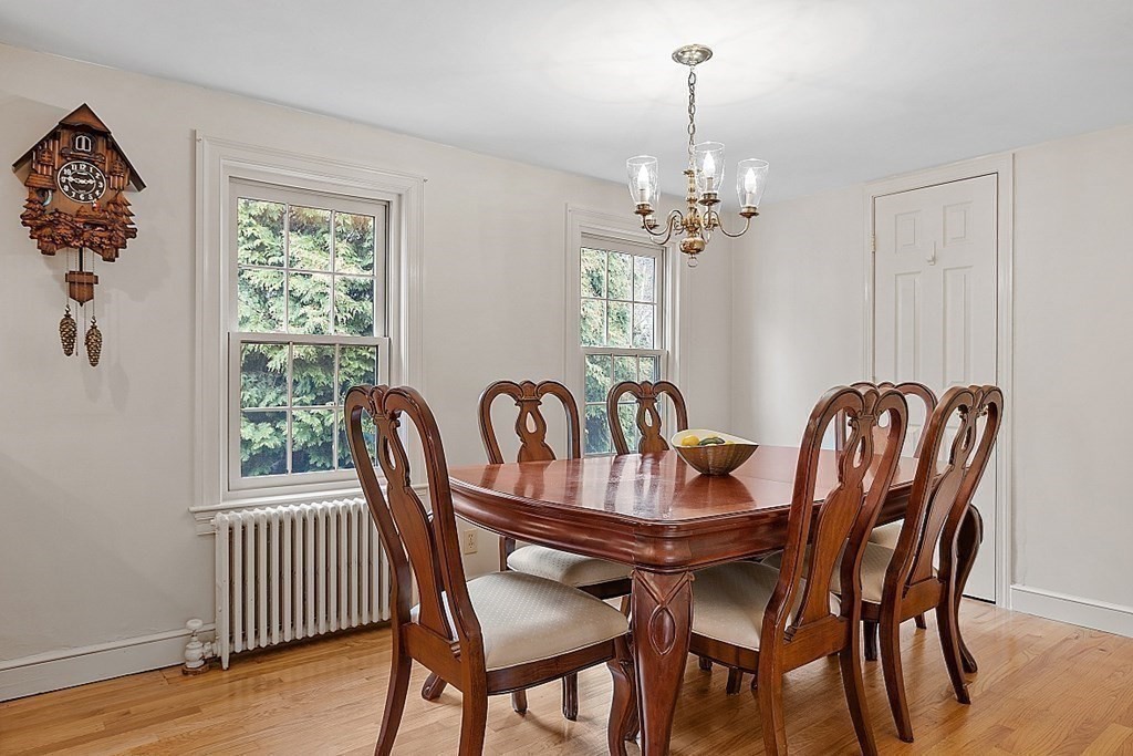 5 Gleason Road Lexington, MA 02420 - Photo 9 of 32 a dining room with furniture a chandelier and wooden floor