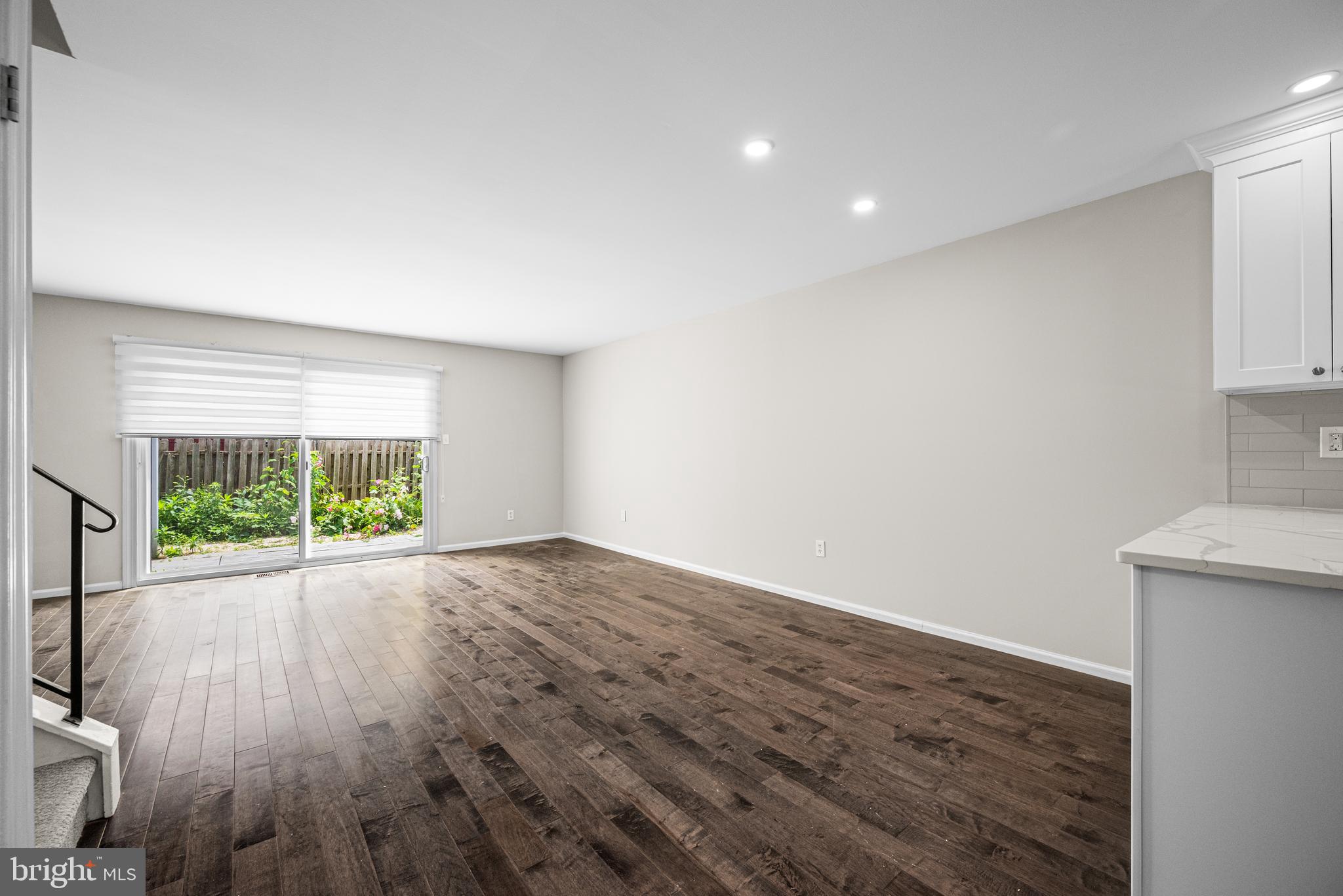 15 Llanfair Road, Unit D Ardmore, PA 19003 - Photo 6 of 29 Great Room with sliding doors to private patio