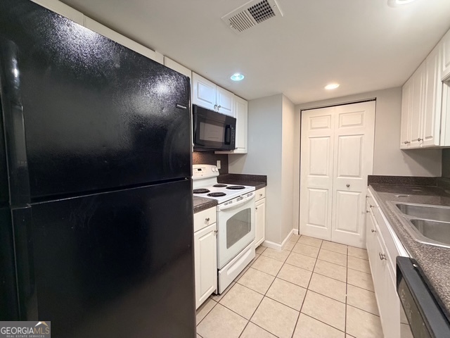3810 Kensingwood Trace Decatur, GA 30032 - Photo 2 of 16 a kitchen with stainless steel appliances granite countertop a refrigerator a stove a sink and a microwave