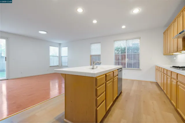 a kitchen with sink and window