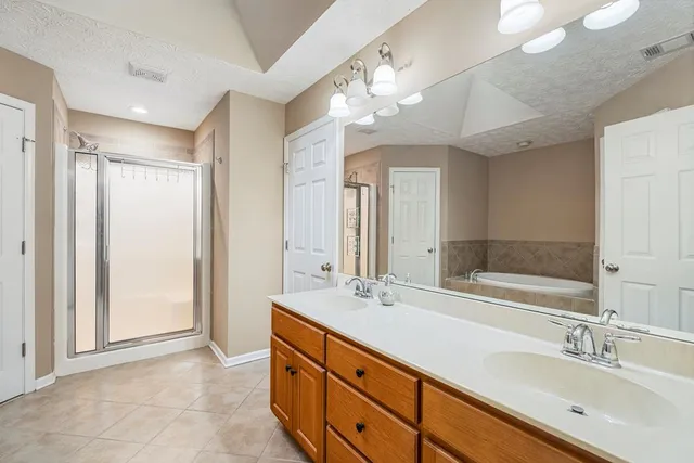 a bathroom with a double vanity sink mirror and double