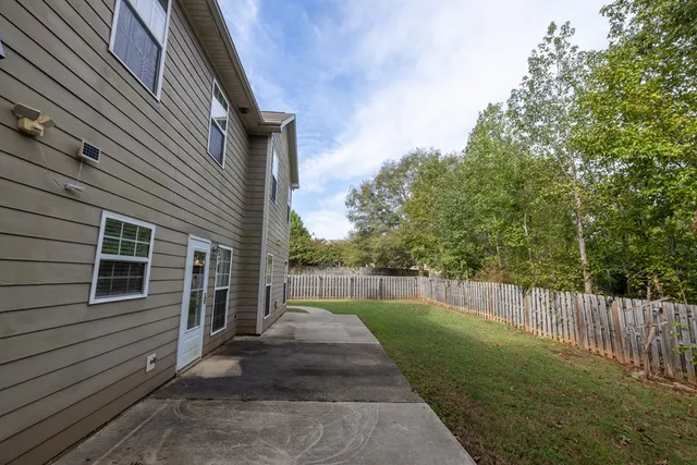 a view of a back yard of the house