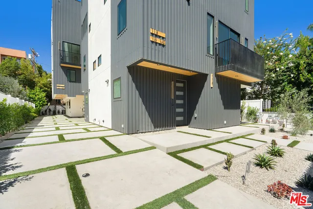 a view of a house with a street