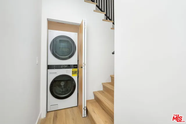 a view of a hallway with washer and dryer