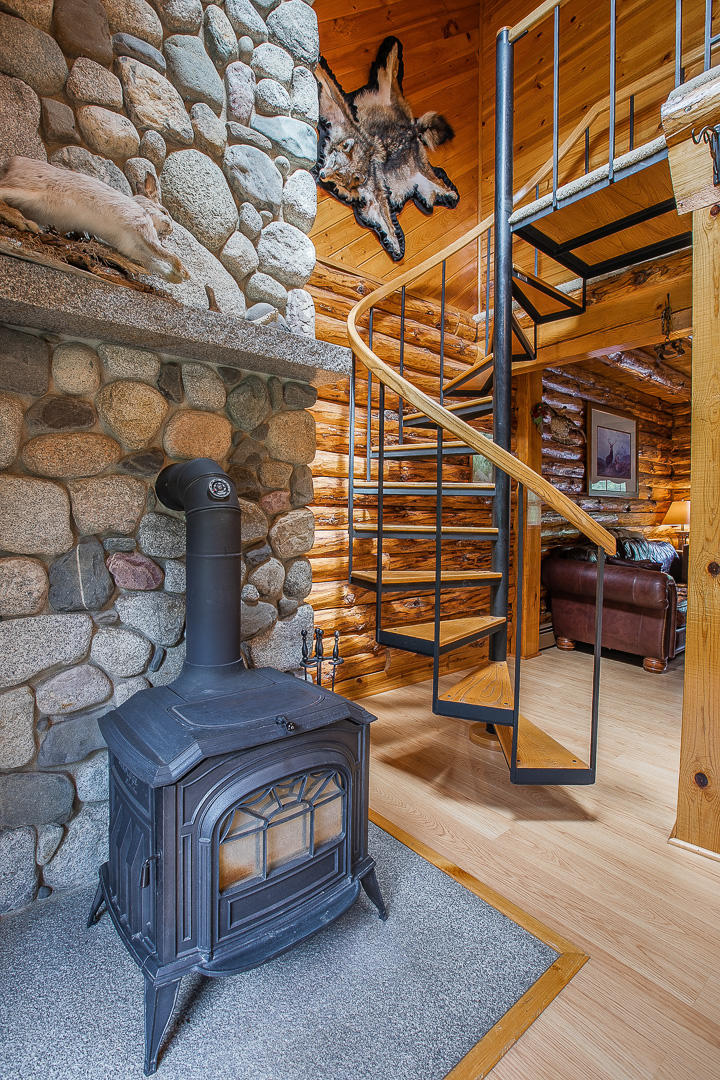 161 Brown Road Harmony, ME 04942 - Photo 20 of 44 Fireplace and Spiral stairs