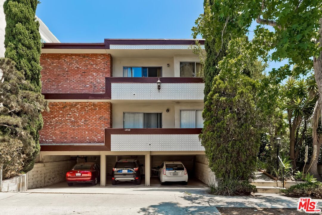 a front view of a building with parking