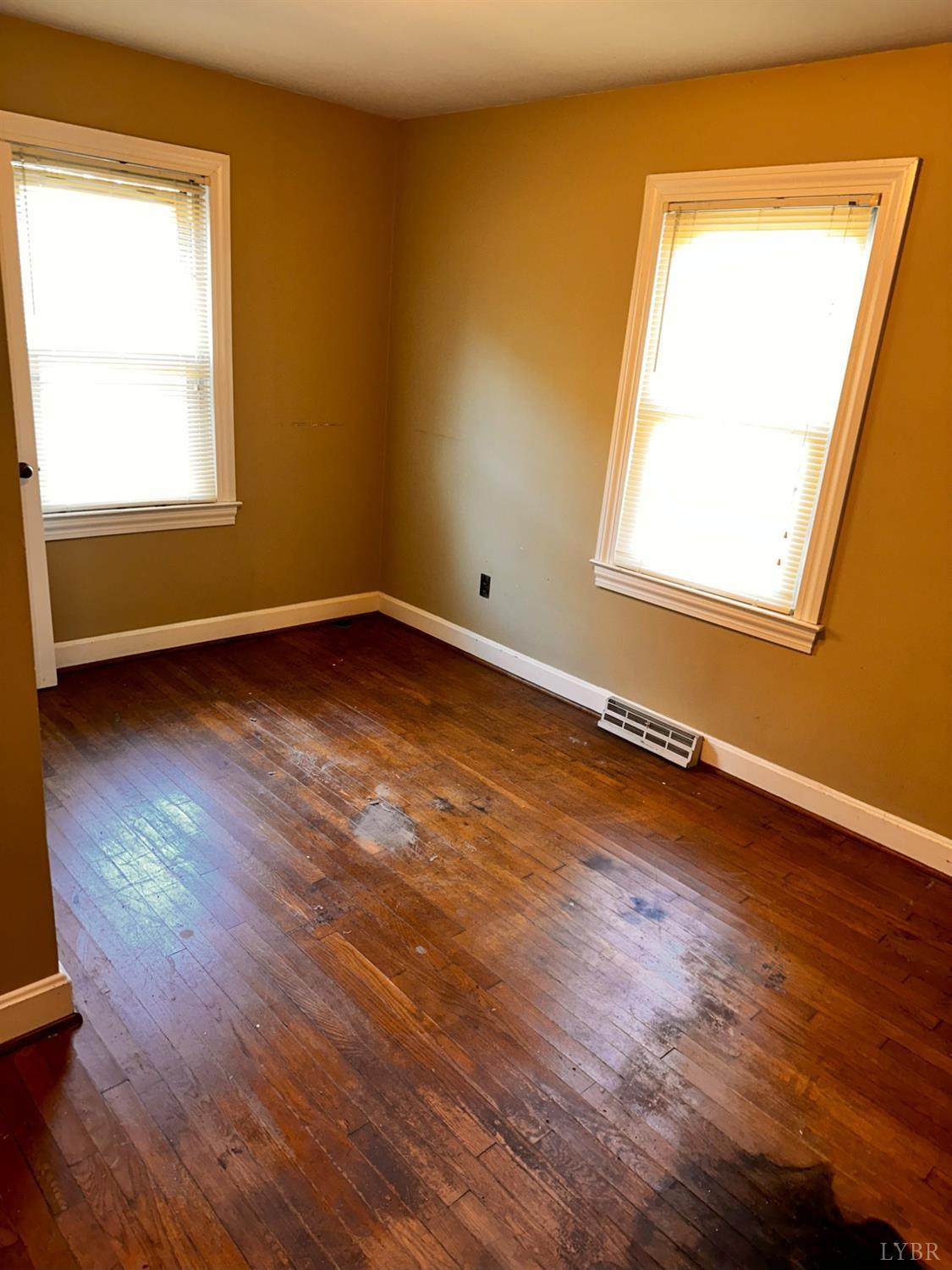 1724 Stone Mill Road Hurt, VA 24563 - Photo 26 of 37 a view of a room with wooden floor and a window