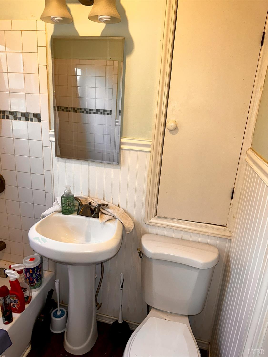 1724 Stone Mill Road Hurt, VA 24563 - Photo 33 of 37 a white toilet sitting next to a bathroom sink