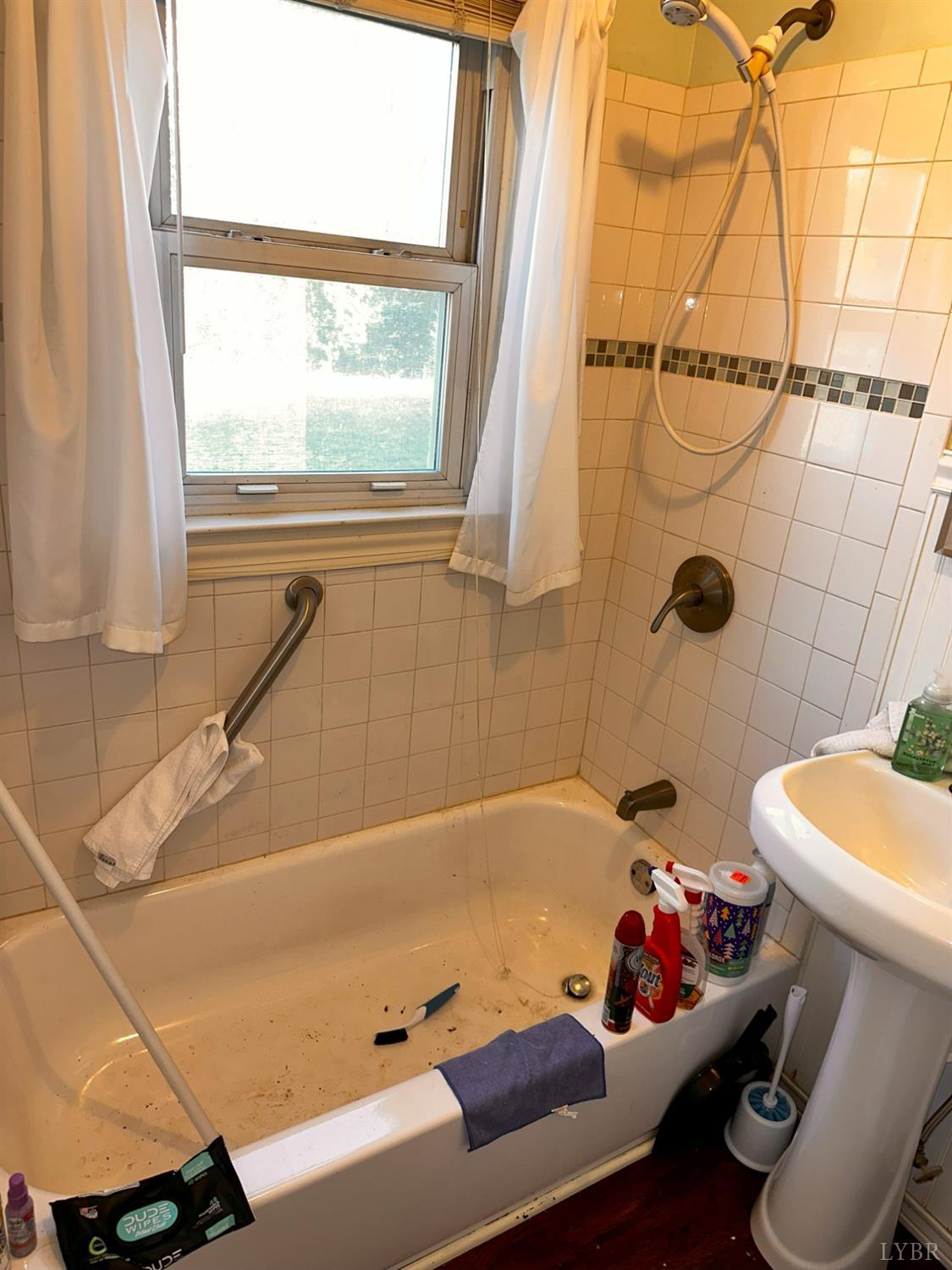 1724 Stone Mill Road Hurt, VA 24563 - Photo 34 of 37 a white bath tub sitting next to a white toilet and sink