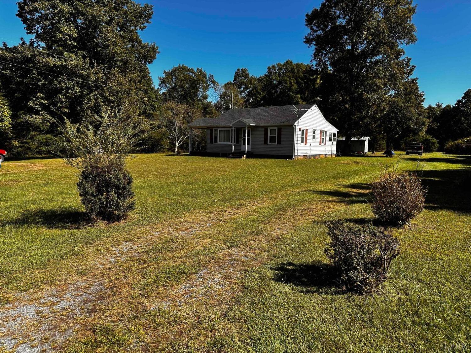 1724 Stone Mill Road Hurt, VA 24563 - Photo 4 of 37 a front view of a house with a yard