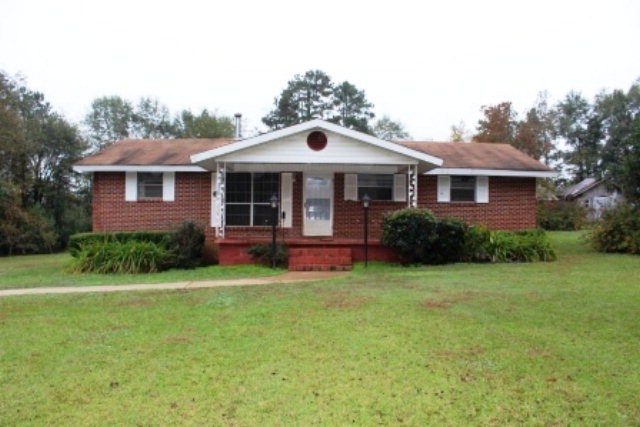 204 Hickman Road Forsyth, GA 31029 - Photo 1 of 13 a front view of a house with a garden