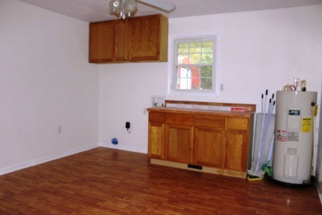 204 Hickman Road Forsyth, GA 31029 - Photo 8 of 13 a view of a room with wooden floor and a window
