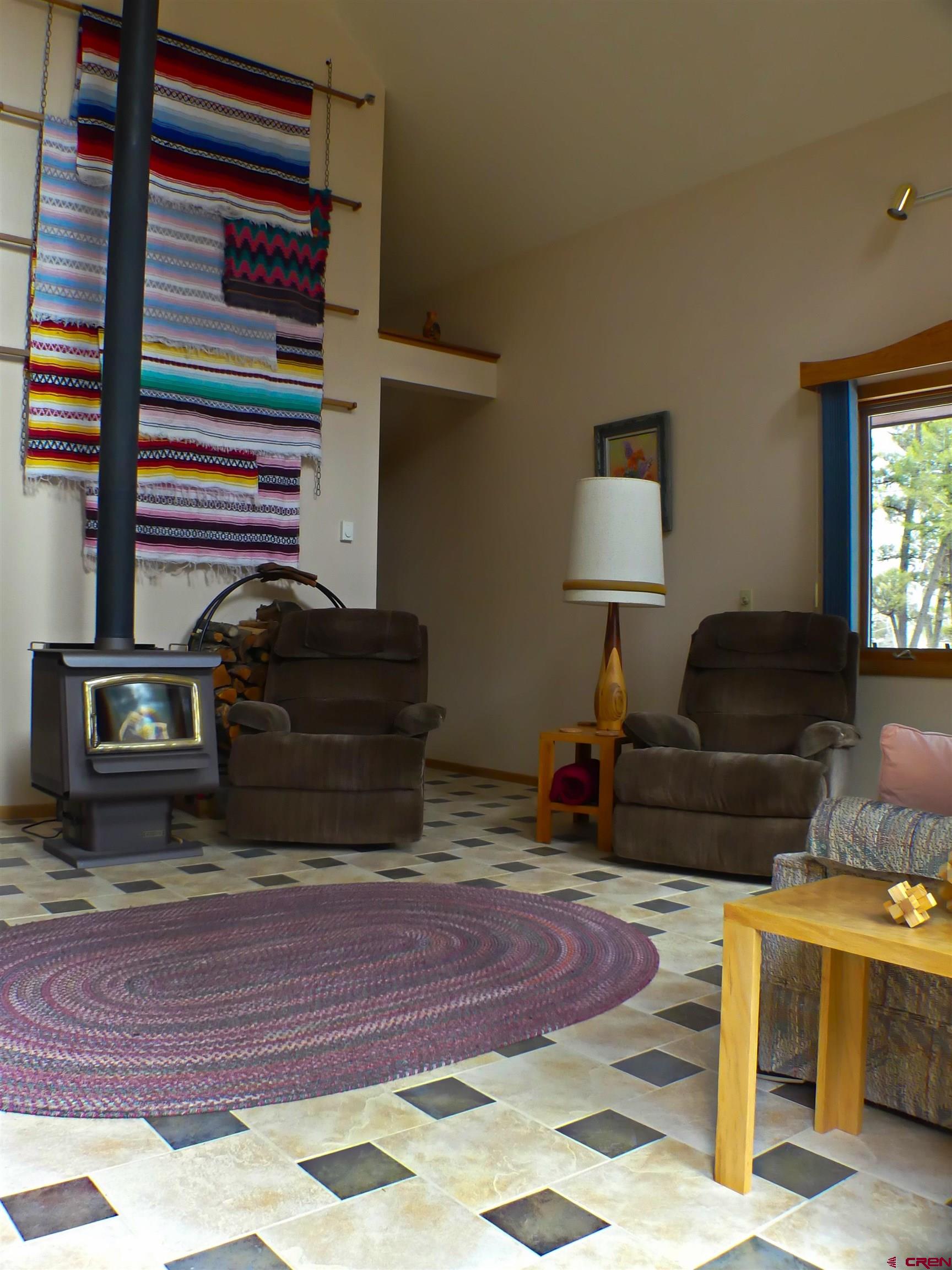 453 Ute Road Cimarron, CO 81220 - Photo 2 of 18 a living room with furniture and a fireplace