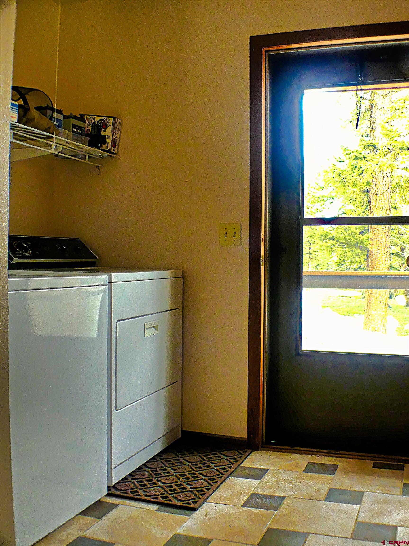 453 Ute Road Cimarron, CO 81220 - Photo 10 of 18 a view of a kitchen with wooden floor and a window