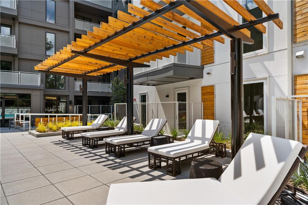 775 Juniper Street Northeast, Unit 404 Atlanta, GA 30308 - Photo 14 of 22 a view of backyard with swimming pool and furniture