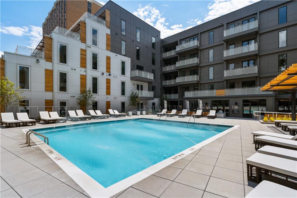 775 Juniper Street Northeast, Unit 404 Atlanta, GA 30308 - Photo 16 of 22 a view of swimming pool with outdoor seating