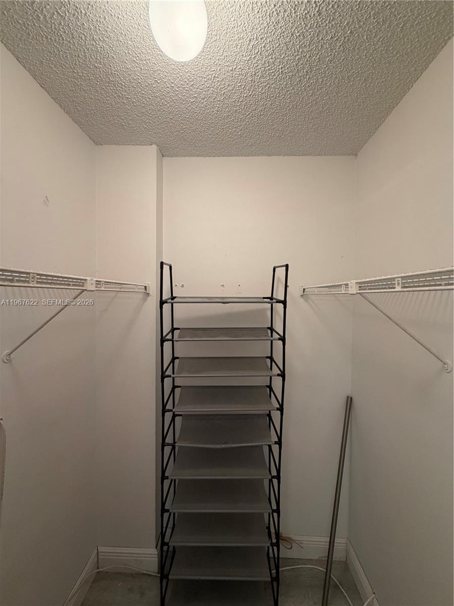 3910 Inverrary Boulevard, Unit 803B Lauderhill, FL 33319 - Photo 14 of 18 a view of walk in closet with empty racks