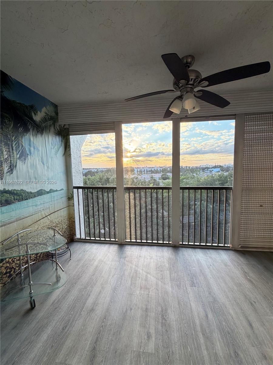 3910 Inverrary Boulevard, Unit 803B Lauderhill, FL 33319 - Photo 17 of 18 wooden floor in an empty room with a window