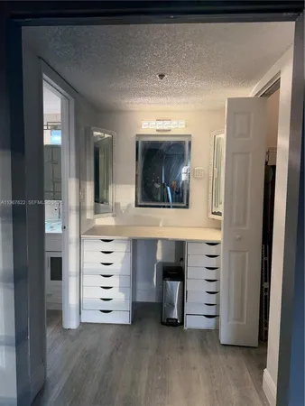 a room with cabinets and a wooden floor