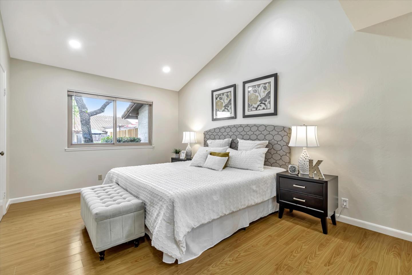 146 Brahms Way Sunnyvale, CA 94087 - Photo 11 of 24 a bedroom with a bed and a lamp on table